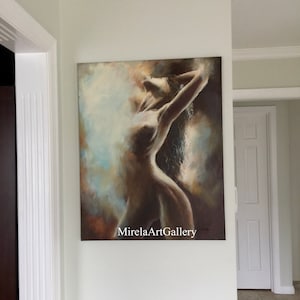 May include: A painting of a nude figure with long hair, standing with arms raised, against a background of soft, muted colors. The painting is signed "MirelaArtGallery".
