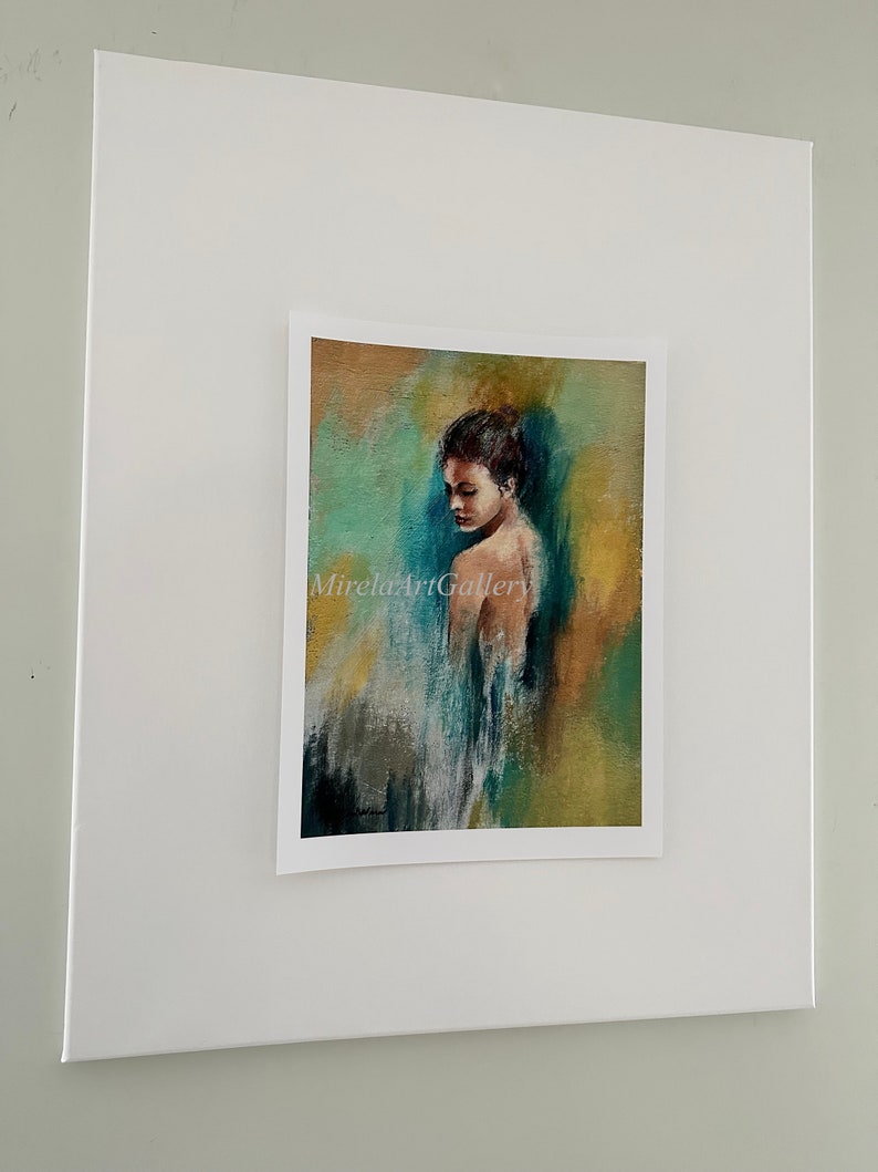 May include: A painting of a woman with brown hair, wearing a white dress, standing in front of a colorful abstract background. The background is a mix of green, blue, and yellow.