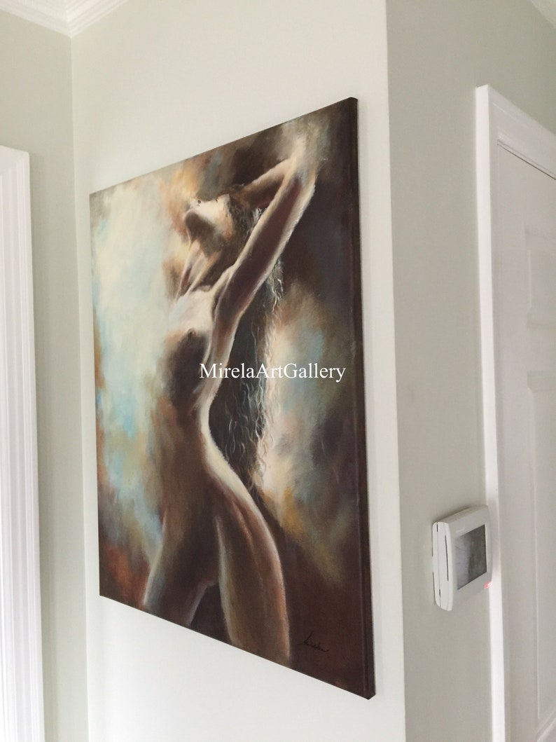 May include: A painting of a nude woman with long hair, standing with her arms raised above her head. The painting is done in a soft, muted palette of browns, blues, and whites. The background is a blurry, abstract design. The painting is signed in the lower right corner.