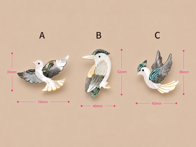 May include: Three decorative bird brooches. Brooch A is 5.8 cm wide and 3.3 cm tall. Brooch B is 4 cm wide and 5.2 cm tall. Brooch C is 4.3 cm wide and 4.8 cm tall. Each brooch features iridescent and white shell accents.