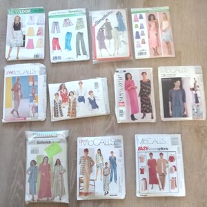 May include: A collection of nine sewing patterns for various clothing items. The patterns are from different brands, including Newlook, Simplicity, and McCall's. The patterns feature a variety of styles, including skirts, dresses, tops, and pants.