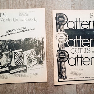May include: Two vintage magazines on a wooden surface. The left magazine is titled "Quilting and Related Needlework" and announces quilting retreats. The right magazine is titled "Patterns Quilts" with a blue ribbon design. Both magazines are in black and white.