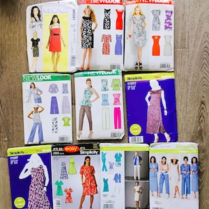 May include: A collection of ten sewing pattern envelopes from brands including McCall's, New Look, and Simplicity. Each envelope displays illustrations or photographs of various garments like dresses, tops, and trousers, along with brand logos and text.