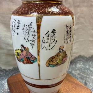 VASE KUTANI JAPANESE rare hand painted gods and poems rare find highly sought after Japanese 7 1/4” tall kutani vase/ jar no damage.