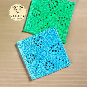 May include: Two square crochet coasters. One is bright green, the other is light blue. Both have an openwork design with small holes. The coasters are placed on a light brown wooden surface. The image includes a logo that says "VIDEO TUTORIAL".