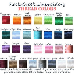 May include: A color chart from Rock Creek Embroidery displays thread colors. The chart includes a variety of colors, such as fire engine red, orange, yellow, green, blue, pink, and black. Each color is labeled with its name.