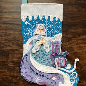 Finished Bucilla stocking in pattern “Winter Magic”