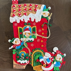 Finished Bucilla stocking in pattern “Holiday Decorating”