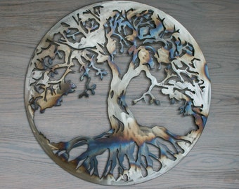May include: A metal wall art sculpture of a tree of life with intricate branches and roots. The sculpture is circular and has a rustic, burnished finish.