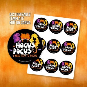 May include: A sheet of round stickers with a Halloween theme. The stickers feature the text "Hocus Pocus I Need Tea to Focus" with silhouettes of the Sanderson sisters in purple, orange, and yellow. The background is orange.
