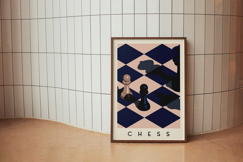 May include: A framed art print featuring a chess-themed design. The artwork displays a chessboard pattern in navy blue and blush pink, with chess pieces. The word "CHESS" is printed at the bottom of the print.