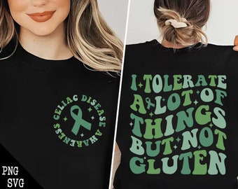 Könnte beinhalten: Schwarzes T-Shirt mit einer grün-weißen Grafik, auf der "Ich toleriere viele Dinge, aber kein Gluten" steht. Die Vorderseite des Shirts hat einen grün-weißen Kreis mit einem Band und dem Text "Zöliakie-Bewusstsein".
