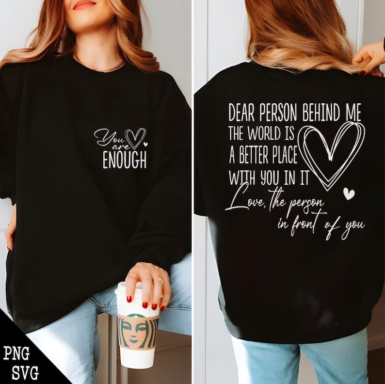 May include: Black sweatshirt with a white graphic on the front that says "You are enough" with a heart. The back of the sweatshirt has a white graphic that says "Dear person behind me the world is a better place with you in it Love, the person in front of you" with a heart.