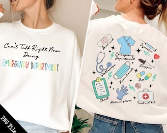 May include: White sweatshirt with the text "Can't Talk Right Now Doing EMERGENCY DEPARTMENT" in rainbow colors. The back of the sweatshirt has a white background with colorful illustrations of medical supplies, including a stethoscope, bandaid, chart, medical gloves, first aid kit, medical mask, dropper, pill, and injection.