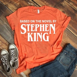 Base On The Novel By Stephen King T-Shirt, Stephen King Tee Shirt, unisex adult clothing, tops & tees, Women's Clothing, clothing gift