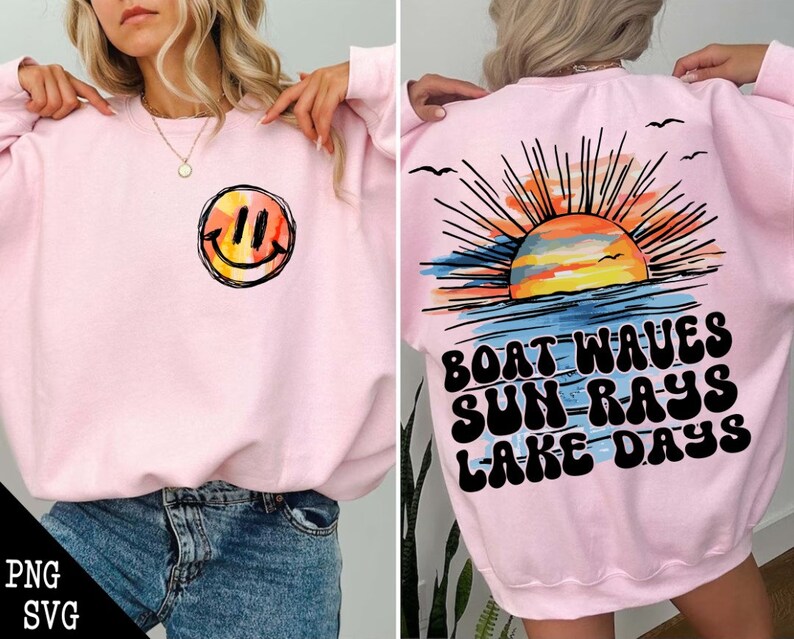 May include: Pink sweatshirt with a smiley face on the front and a sunset graphic with the text "Boat Waves Sun Rays Lake Days" on the back.