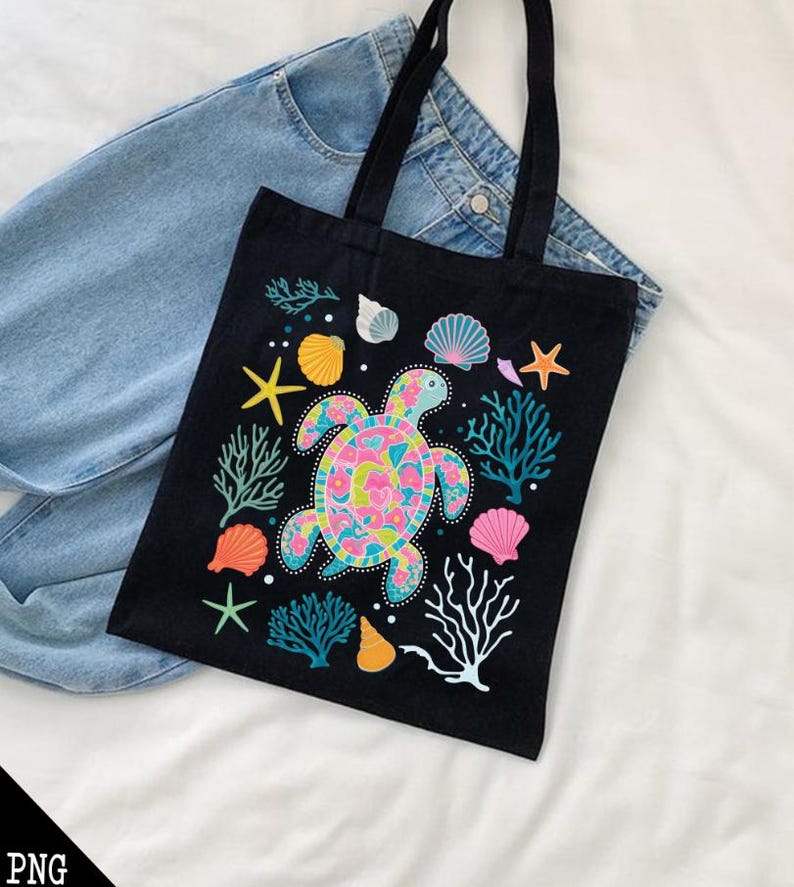 May include: Black canvas tote bag with a colorful sea turtle design. The turtle is surrounded by coral, seashells, and starfish.