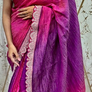 Crush Tissue shaded saree adorned with scalloped edges, paired with a stunning computer-embroidered butti blouse piece for party wear saree