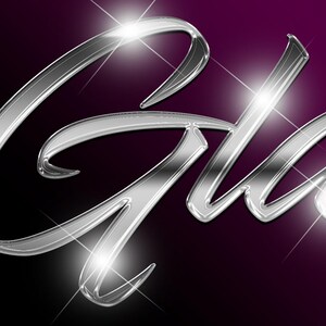 May include: A silver metallic word "Glam" with a shiny, reflective surface and sparkling highlights.