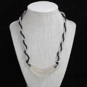 Onyx and Crystal Twisted Beaded Necklace with Crystal Boomerang pendant