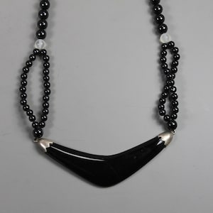 Onyx and Crystal Beaded Necklace with an Onyx Boomerang Pendant