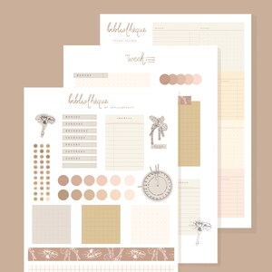 May include: A set of printable planner stickers with a botanical theme. The stickers feature illustrations of flowers, leaves, and a compass. The stickers are in shades of brown, beige, and pink.