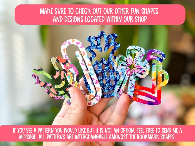 May include: Five colorful paper clip bookmarks in different shapes, including a pineapple, a bird, and a flower. The bookmarks are made of paper and have a variety of patterns. The text on the image reads: "Make sure to check out our other fun shapes and designs located within our shop. If you see a pattern you would like but it is not an option, feel free to send me a message. All patterns are interchangeable amongst the bookmark shapes."