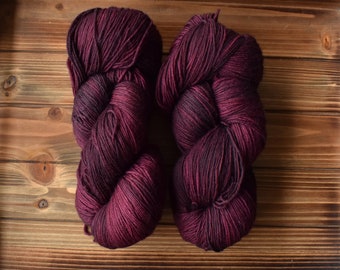 Mulberry: Hand-dyed Yarn. Purplish Red. Maroon Pink. Dark Magenta. Merino Wool Superwash Fingering Sock Yarn. Tonal. Semi-solid yarn.