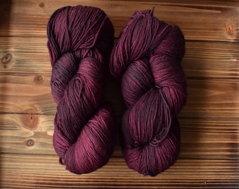 Mulberry: Hand-dyed Yarn. Purplish Red. Maroon Pink. Dark Magenta. Merino Wool Superwash Fingering Sock Yarn. Tonal. Semi-solid yarn.