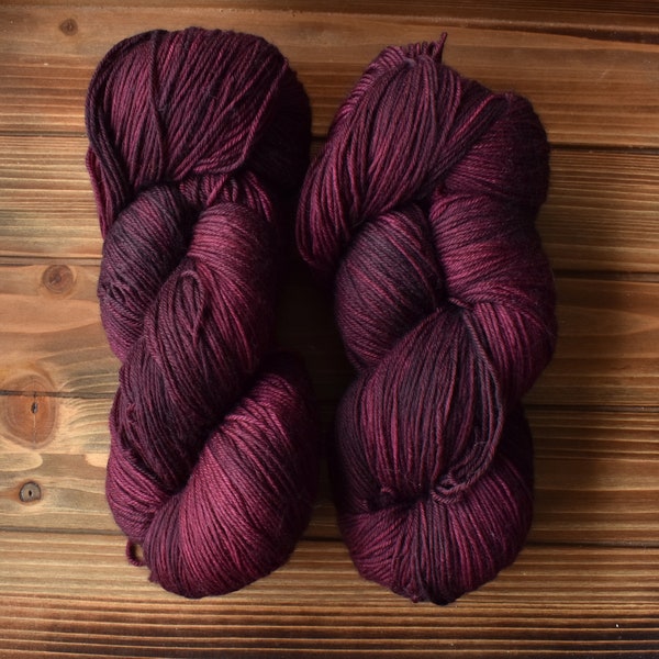Mulberry: Hand-dyed Yarn. Purplish Red. Maroon Pink. Dark Magenta. Merino Wool Superwash Fingering Sock Yarn. Tonal. Semi-solid yarn.