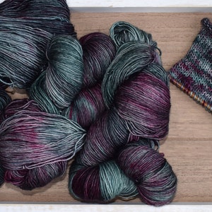 Alum Cave: Hand Dyed  Superwash Merino Wool Fingering Sock Yarn. Tonal Green. Purple. Magenta. Knitting. Crochet. Multi-colored yarn.