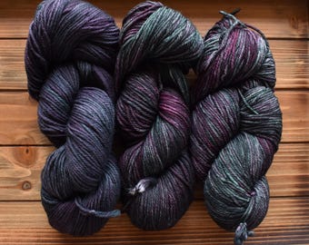 Alum Cave: Hand Dyed Superwash Merino Wool Fingering Sock Yarn. Tonal Green. Purple. Magenta. Gray. Multi-colored yarn.