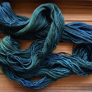 Peacock: Hand-dyed Superwash Merino Wool Fingering Sock Yarn. Tonal. Green. Blue. Teal yarn. Turquoise. Knitting. Semi-solid teal yarn.