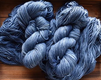 Denim: Denim blue Hand-dyed Wool Yarn. Tonal blue yarn.  Semi-solid yarn. Pale blue yarn. Pastel blue. Light blue. Pink and yellow Speckles.