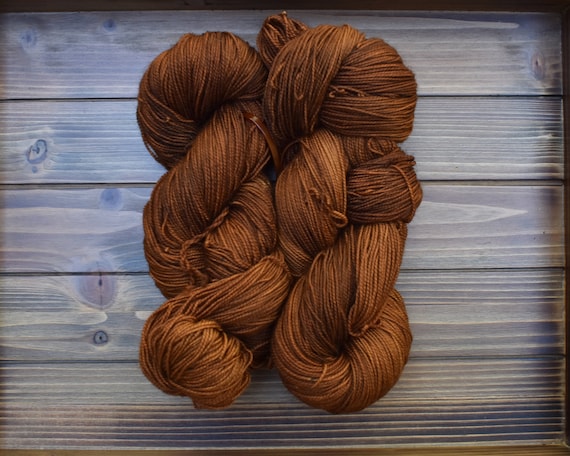 Caramel: Hand-dyed, Merino Wool Superwash Sock Yarn. Tonal golden brown  yarn. Semi-solid yarn. Dark tan yarn. Golden yellow. Fall yarn.