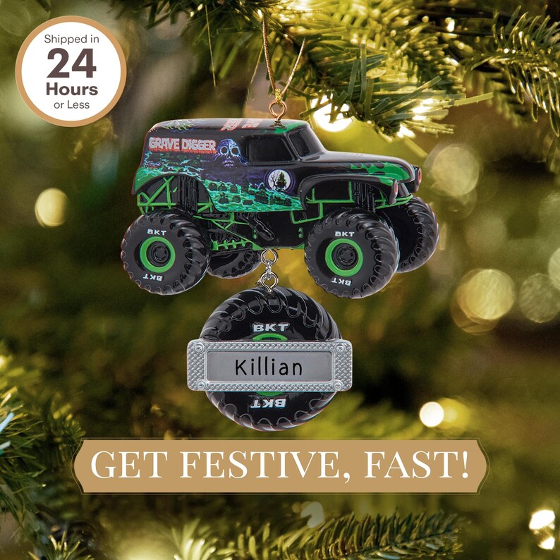 May include: A black and green monster truck ornament with the text "GRAVE DIGGER" and "BKT". The ornament has a personalized tag that says "Killian". The text "GET FESTIVE, FAST!" is also visible.
