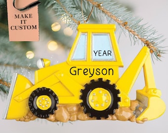 Puede incluir: Adorno de Navidad de excavadora de juguete amarilla con el nombre Greyson y la palabra YEAR en él.