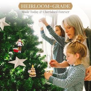 a woman and two girls decorating a christmas tree