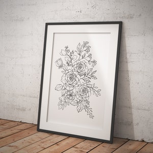 以下が含まれることがあります： 白と黒の線画で描かれた、バラやその他の花をシンプルでミニマルなスタイルで描いた花束のプリント。プリントは黒いフレームで額装され、白いレンガの壁にかけられています。