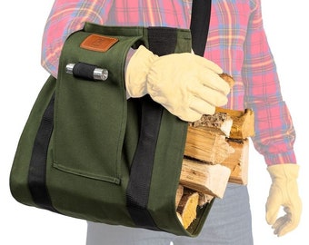 May include: A green canvas firewood carrier with a black strap and a black pocket on the side. The carrier is filled with firewood and being carried by a person wearing a red and black plaid shirt.