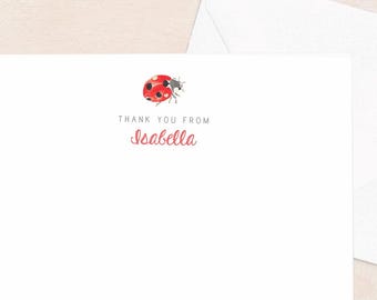 May include: White stationery set featuring a ladybug illustration. The card reads "THANK YOU FROM Seabella" in red script. Includes a matching white envelope. Perfect for sending thank you notes.