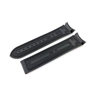 May include: Black rubber watch strap with a textured pattern. The strap has a curved end and a straight end.
