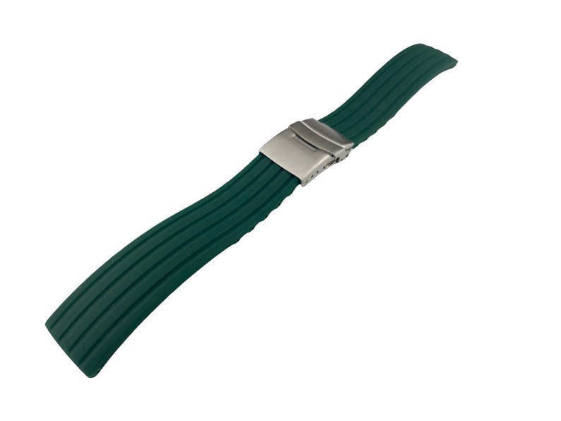 May include: A dark green rubber watch strap with a stainless steel buckle.