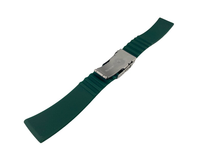 May include: A dark green silicone watch strap with a silver buckle. The buckle has the word "SWISS" engraved on it.