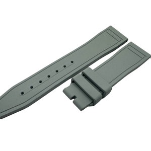 May include: A grey rubber watch strap with a buckle. The strap has a textured surface and is designed for a watch with a lug width of 22mm.