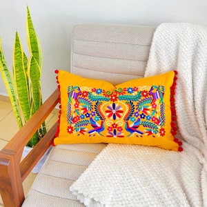 Lumbar pillow cover with red and blue Mexican embroidery and with pompoms Otomi style embroidery perfect for Mexican style decoration