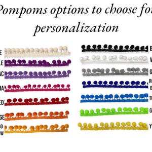 May include: A chart showing 10 different colors of pom pom trim. The colors are beige, purple, lilac, fuchsia, red, orange, mango yellow, black, white, grey, royal blue, turquoise, green, and yellow.