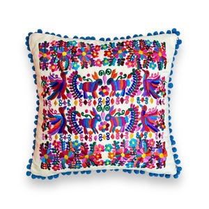 Mexican Pillow cover with Otomi style embroidery and colorful Mexican embroidered flowers ideal for decorating spaces with Mexican style