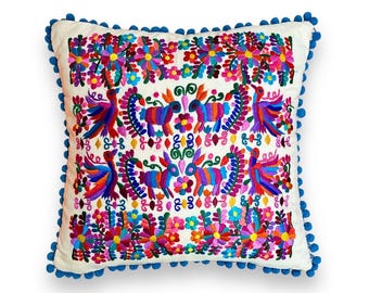 Mexican Pillow cover with Otomi style embroidery and colorful Mexican embroidered flowers ideal for decorating spaces with Mexican style
