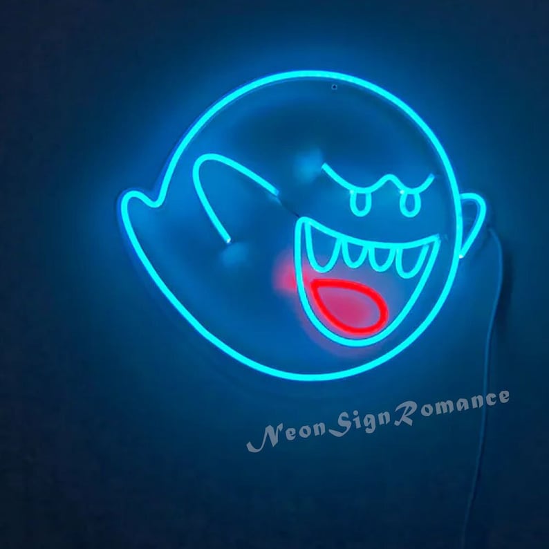 May include: A blue neon sign shaped like a ghost with a red mouth and eyes. The sign says "Neon Sign Romance" at the bottom.